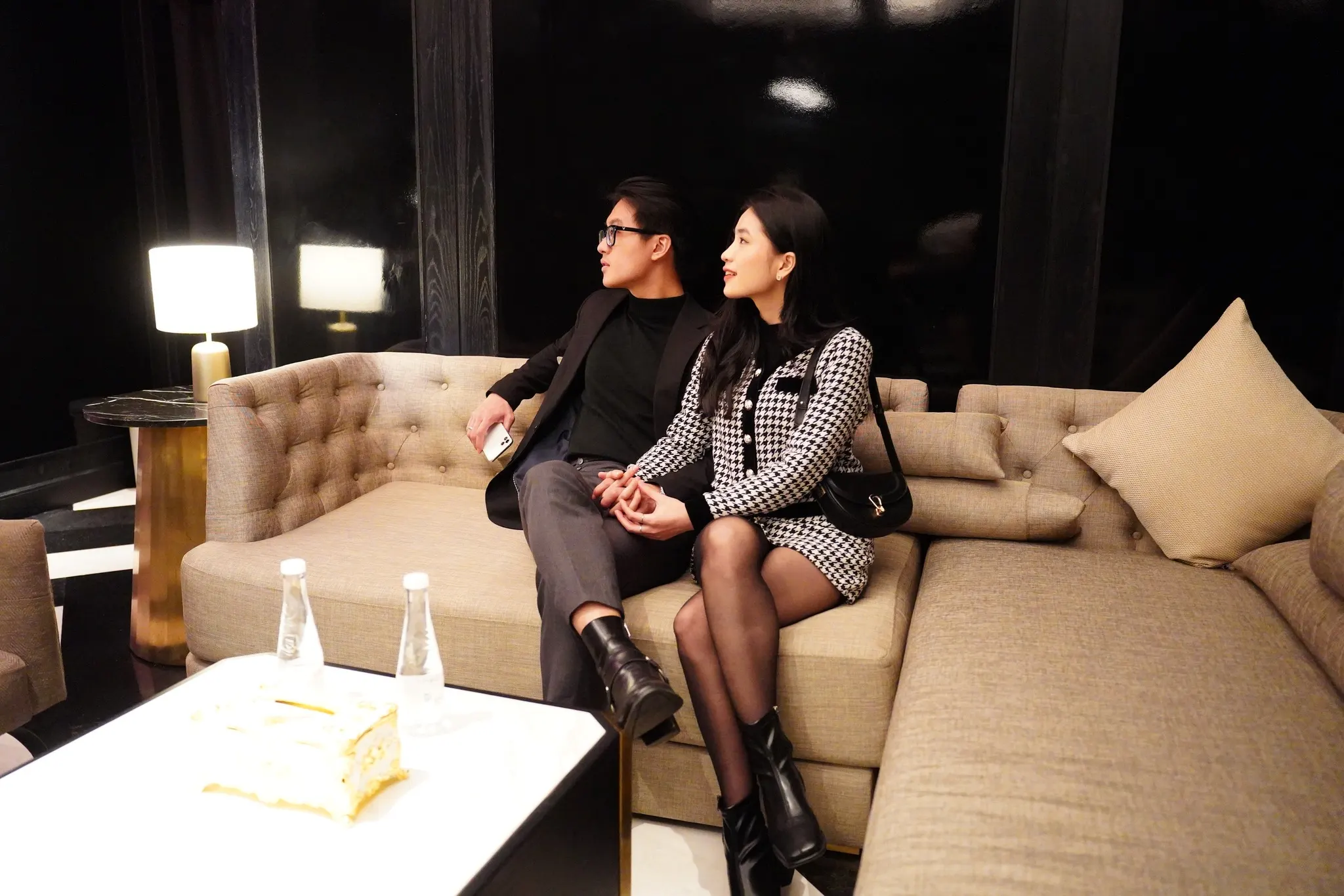 A lively night scene at one of the best karaoke in Hoi An, featuring vibrant lights, modern sound systems, and groups of friends enjoying music.